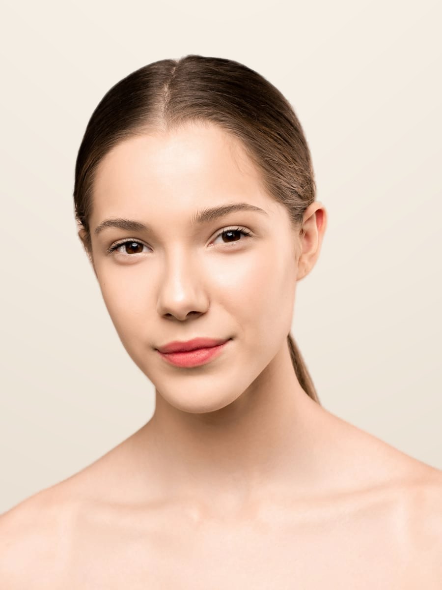 Model with a fair skin tone and radiant, healthy skin