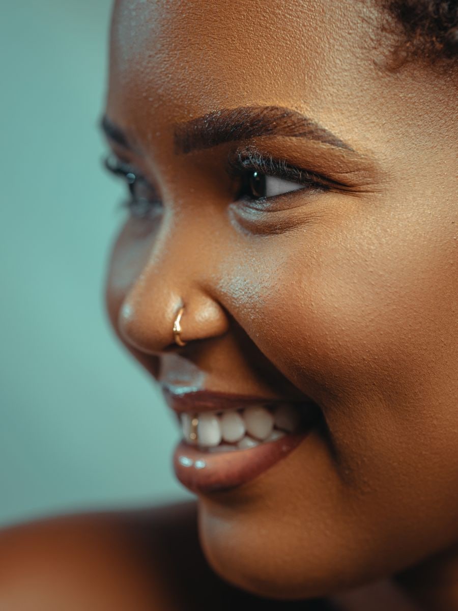 Model with deep skin and a joyful, healthy glow